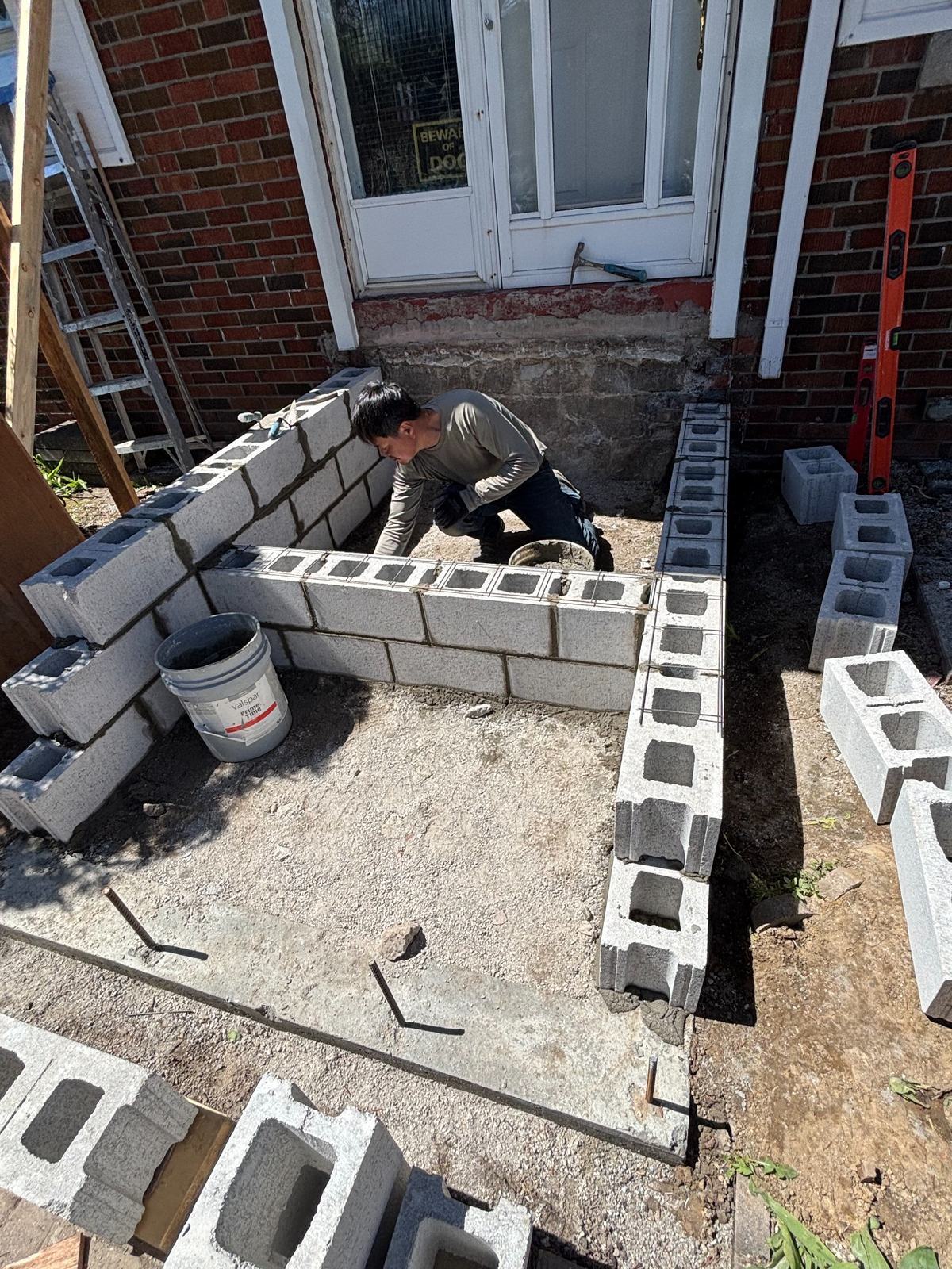 Concrete block wall installation in progress