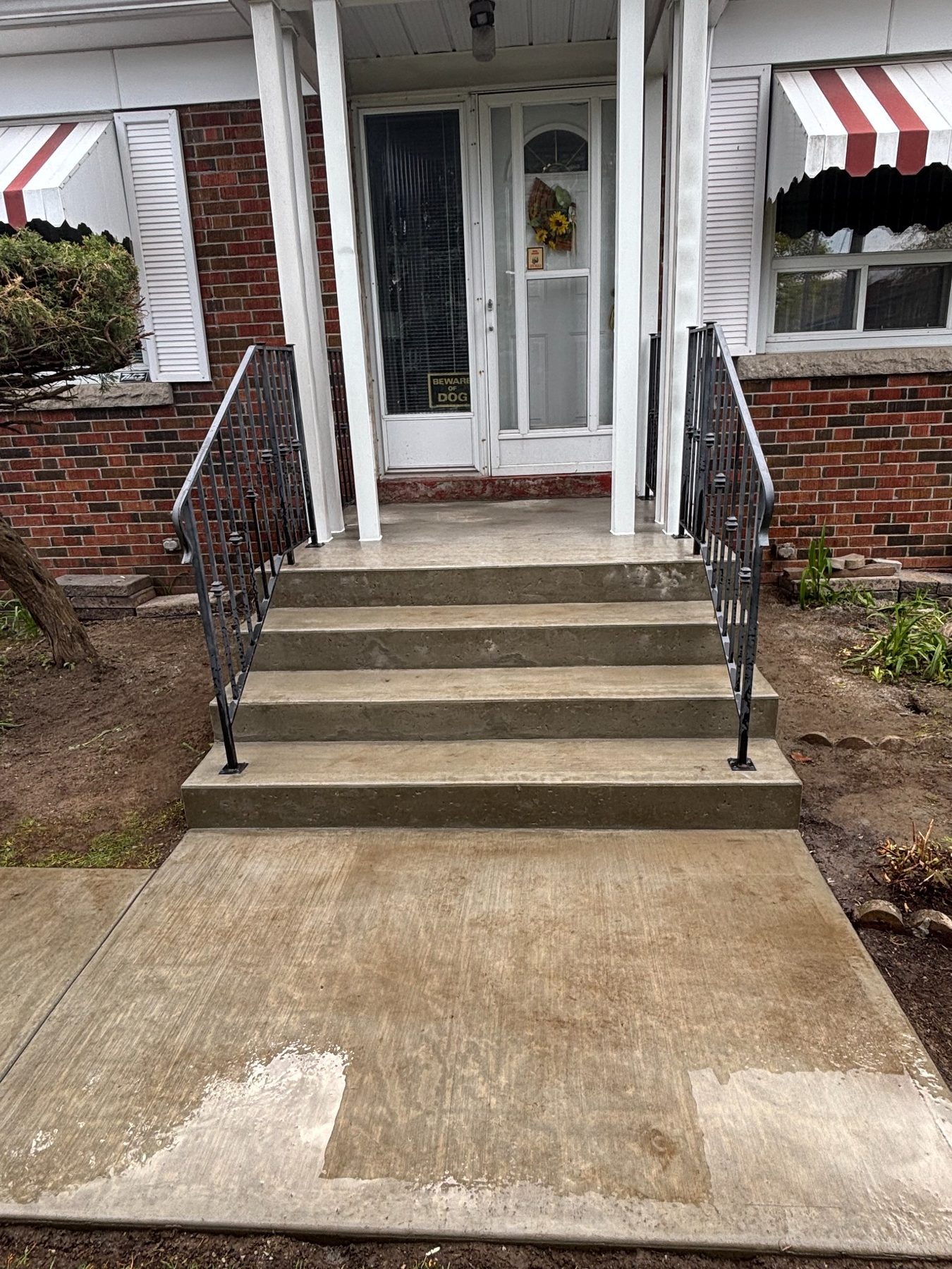 Finished concrete steps with railings