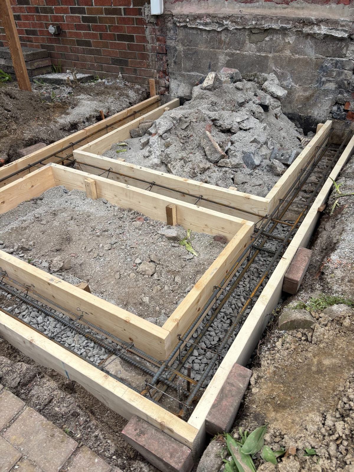 Rebar placement for concrete footing