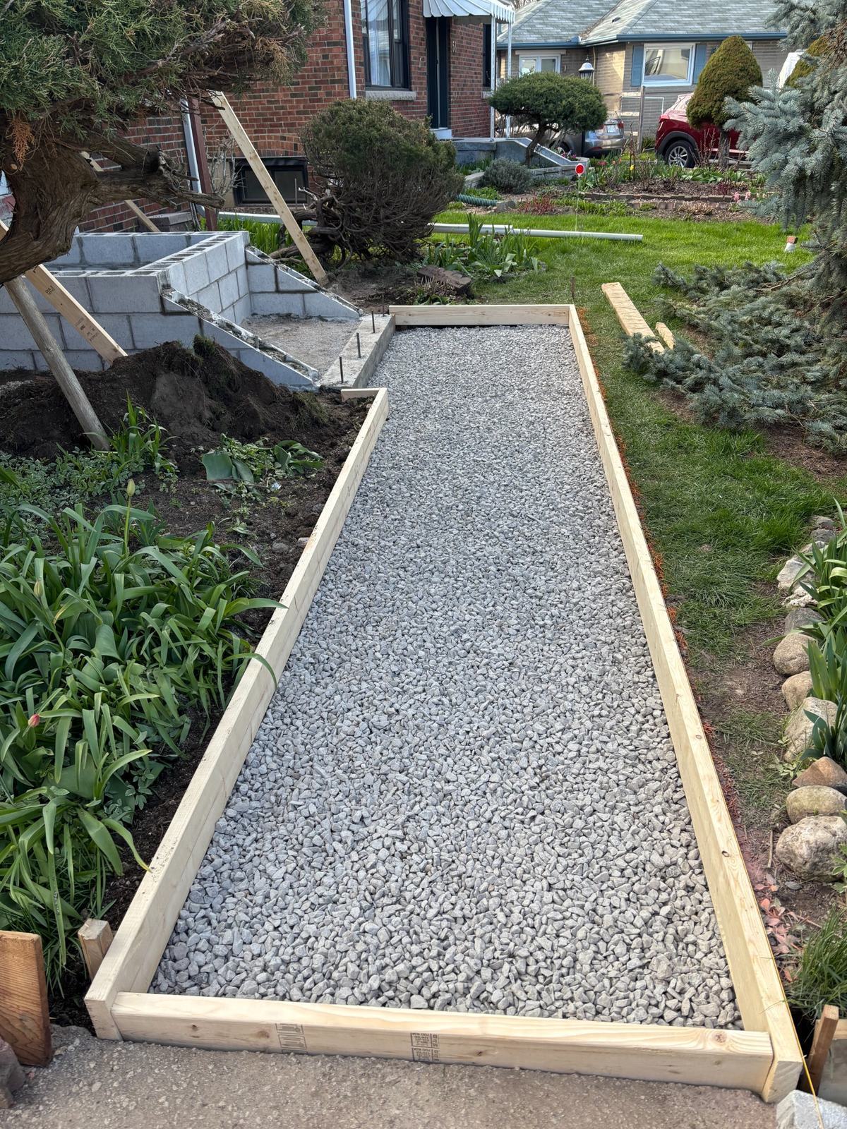 Framed walkway with compacted gravel base